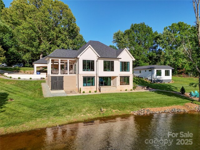 445 Sundown Rd, Mooresville, NC 28117 - back of house with a water view, a yard, and a shingled roof