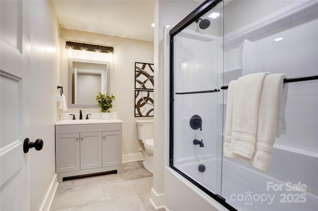 445 Sundown Rd, Mooresville, NC 28117 - full bathroom featuring toilet, vanity, bath / shower combo with glass door, baseboards, and tile patterned floors
