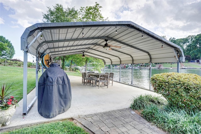 445 Sundown Rd, Mooresville, NC 28117 - view of vehicle parking with a detached carport, a ceiling fan, and a water view