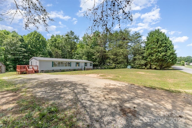 3585 Woodstream Dr, Maiden, NC 28650 - view of front facade with crawl space, a wooden deck, and a front yard