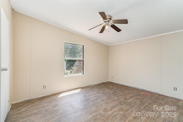 3585 Woodstream Dr, Maiden, NC 28650 - empty room featuring wood finished floors, ceiling fan, ornamental molding, and vaulted ceiling