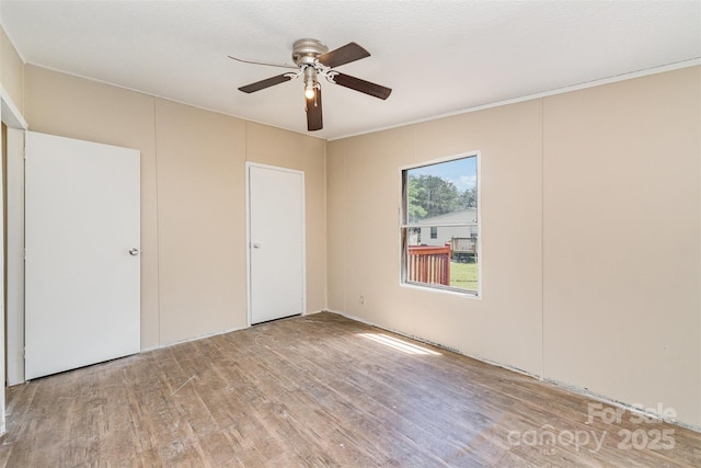 3585 Woodstream Dr, Maiden, NC 28650 - unfurnished bedroom featuring wood finished floors and ceiling fan