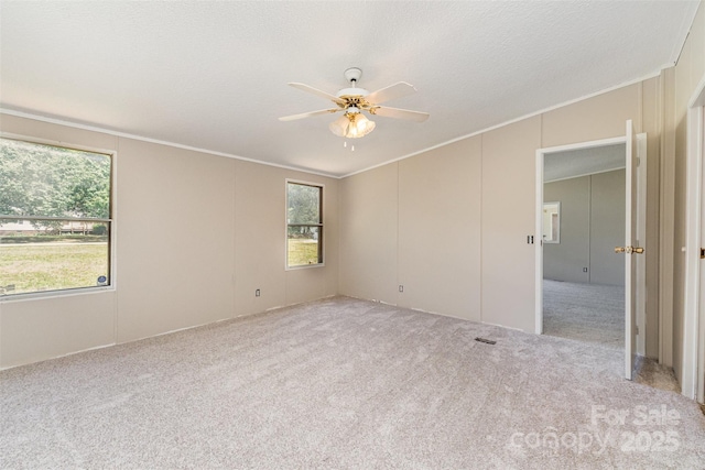 3585 Woodstream Dr, Maiden, NC 28650 - empty room featuring a ceiling fan, ornamental molding, carpet floors, and vaulted ceiling