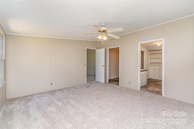3585 Woodstream Dr, Maiden, NC 28650 - unfurnished bedroom with carpet flooring, crown molding, connected bathroom, and ceiling fan