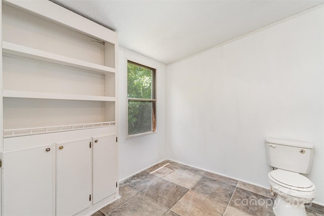 3585 Woodstream Dr, Maiden, NC 28650 - interior space with toilet, stone finish flooring, and baseboards
