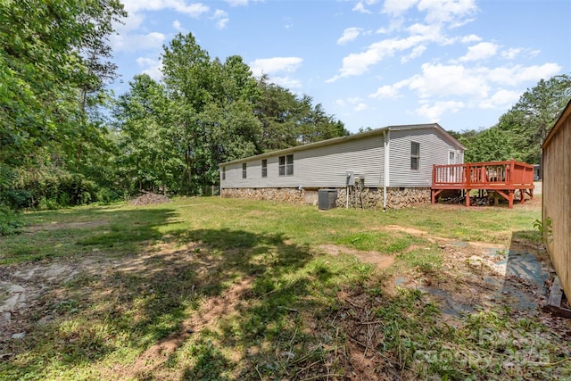3585 Woodstream Dr, Maiden, NC 28650 - view of green lawn with a deck and central air condition unit