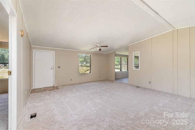3585 Woodstream Dr, Maiden, NC 28650 - unfurnished living room featuring a ceiling fan, carpet flooring, a textured ceiling, and ornamental molding