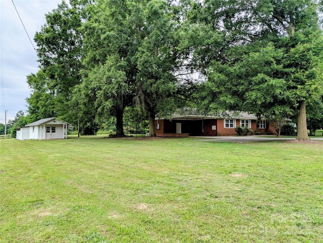 5628 White Store Rd, Wingate, NC 28174 - view of green lawn with an outbuilding