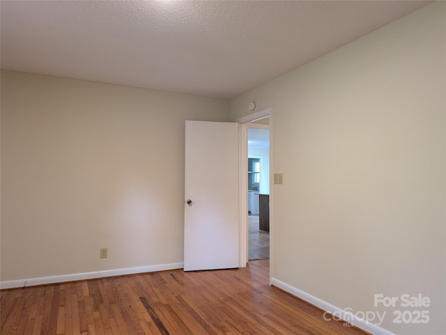 5628 White Store Rd, Wingate, NC 28174 - empty room featuring baseboards and wood finished floors