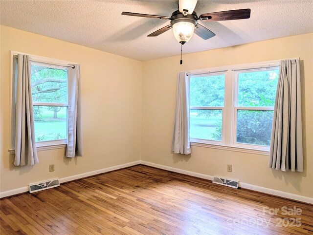 5628 White Store Rd, Wingate, NC 28174 - unfurnished room featuring wood finished floors, ceiling fan, a textured ceiling, and baseboards