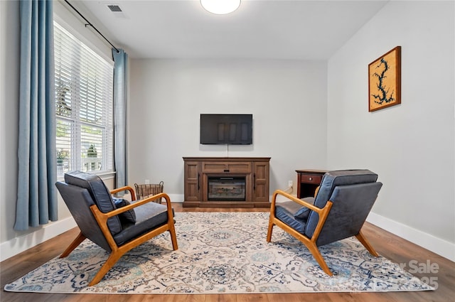 1478 Imperial Ct, York, SC 29745 - living area featuring a glass covered fireplace, baseboards, and wood finished floors