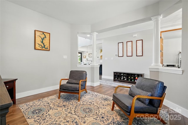 1478 Imperial Ct, York, SC 29745 - living area featuring decorative columns, wood finished floors, and baseboards