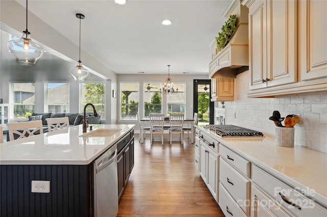 1478 Imperial Ct, York, SC 29745 - kitchen featuring appliances with stainless steel finishes, a sink, wood-type flooring, light countertops, and decorative backsplash
