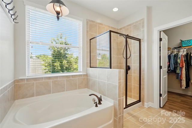 1478 Imperial Ct, York, SC 29745 - full bathroom with a bath, a stall shower, a spacious closet, and tile patterned flooring