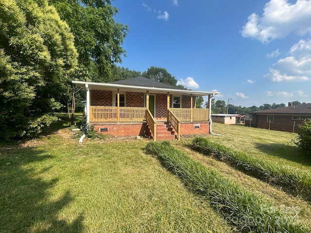 360 Ledbetter Rd, Spindale, NC 28160 - view of front facade with a porch, a front yard, brick siding, and crawl space