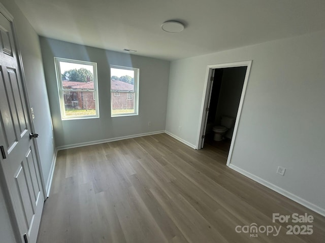 360 Ledbetter Rd, Spindale, NC 28160 - unfurnished bedroom with wood finished floors and baseboards