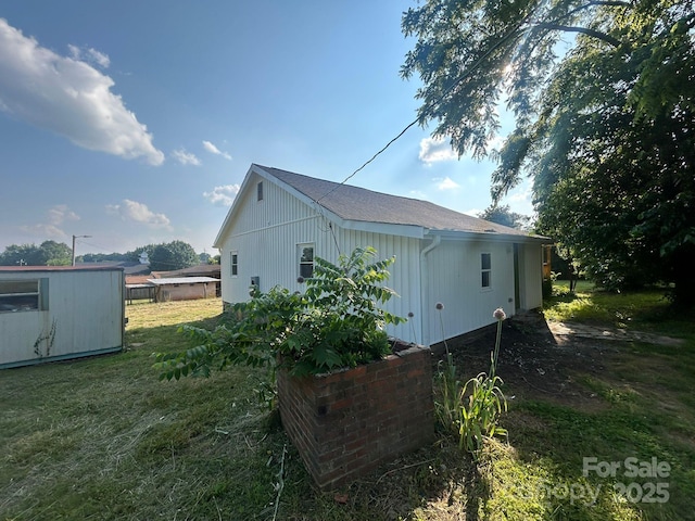 360 Ledbetter Rd, Spindale, NC 28160 - view of home's exterior with a lawn, an outdoor structure, and roof with shingles