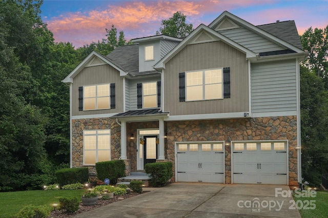 5021 Meadow Woods Dr, Lowell, NC 28098 - view of front of house featuring stone siding, a garage, driveway, and roof with shingles
