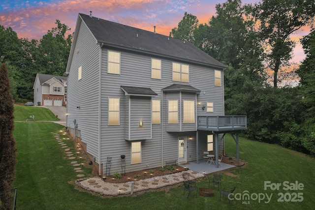 5021 Meadow Woods Dr, Lowell, NC 28098 - back of property featuring a deck, a lawn, and a patio