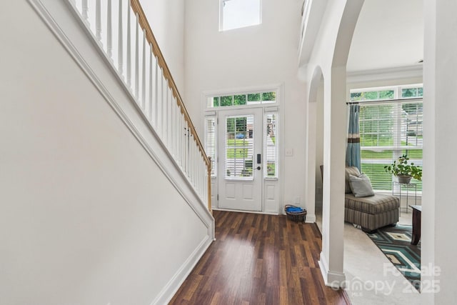 5021 Meadow Woods Dr, Lowell, NC 28098 - entrance foyer with arched walkways, plenty of natural light, wood finished floors, and a high ceiling