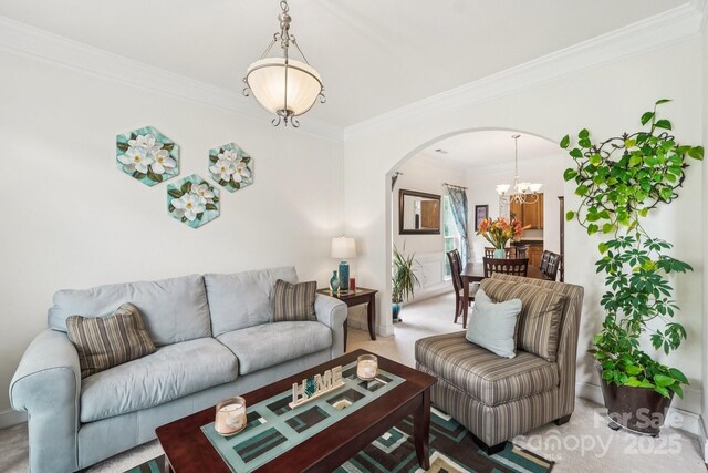 5021 Meadow Woods Dr, Lowell, NC 28098 - living area with arched walkways, a chandelier, crown molding, and carpet