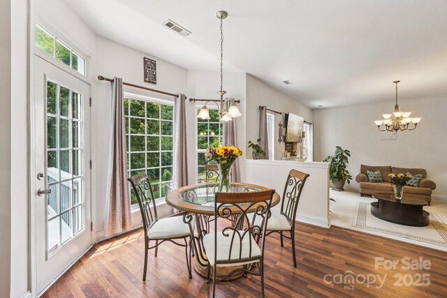 5021 Meadow Woods Dr, Lowell, NC 28098 - dining room with a chandelier and wood finished floors