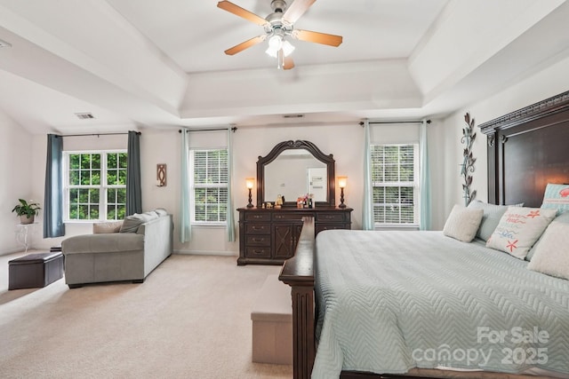 5021 Meadow Woods Dr, Lowell, NC 28098 - bedroom featuring a raised ceiling, light carpet, ceiling fan, and baseboards