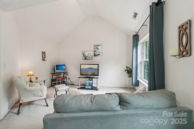 5021 Meadow Woods Dr, Lowell, NC 28098 - living area featuring vaulted ceiling, carpet flooring, and baseboards
