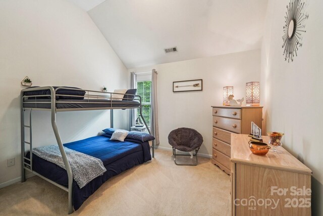 5021 Meadow Woods Dr, Lowell, NC 28098 - bedroom featuring light carpet, vaulted ceiling, and baseboards