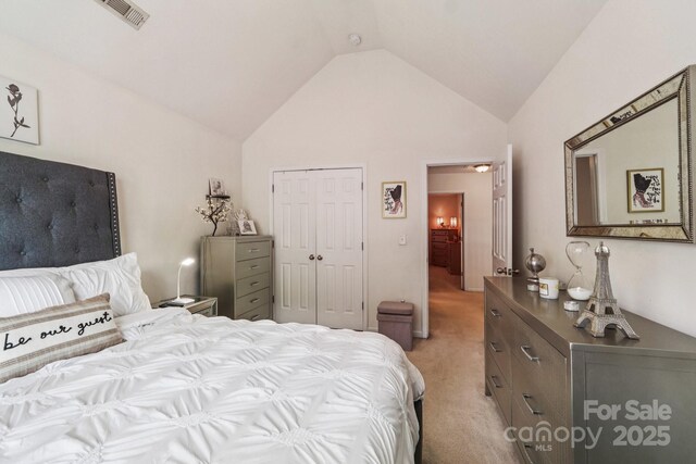 5021 Meadow Woods Dr, Lowell, NC 28098 - bedroom featuring lofted ceiling, light carpet, and a closet