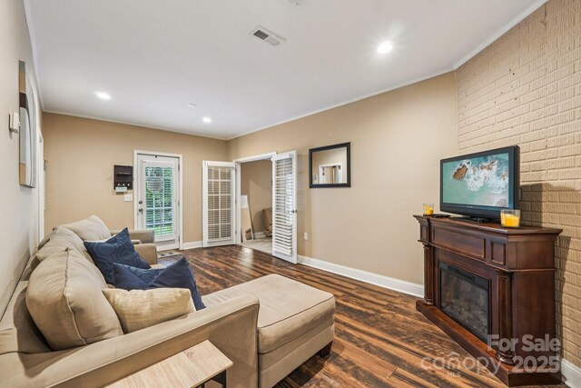 5021 Meadow Woods Dr, Lowell, NC 28098 - living room with dark wood finished floors, a fireplace, recessed lighting, baseboards, and ornamental molding