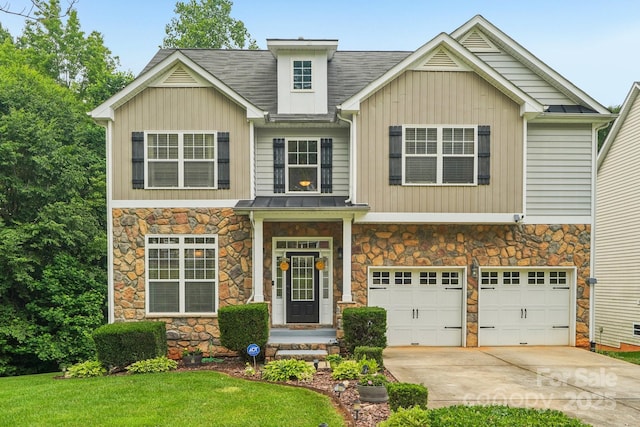 5021 Meadow Woods Dr, Lowell, NC 28098 - view of front of property featuring stone siding, driveway, and an attached garage