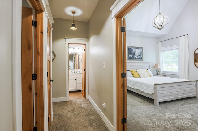 8340 Brief Rd, Mint Hill, NC 28227 - hall with carpet, baseboards, a chandelier, a sink, and lofted ceiling