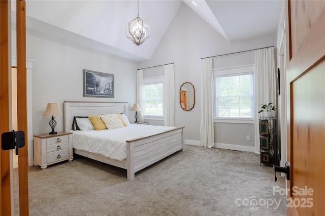 8340 Brief Rd, Mint Hill, NC 28227 - carpeted bedroom featuring a chandelier, baseboards, and high vaulted ceiling
