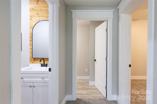 8340 Brief Rd, Mint Hill, NC 28227 - hall featuring a sink, light colored carpet, and baseboards