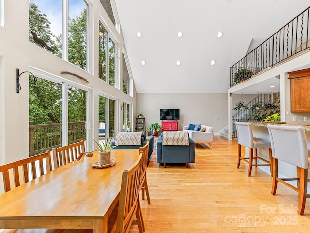 350 Mckissick Rd, Flat Rock, NC 28731 - dining space featuring high vaulted ceiling, light wood-type flooring, and recessed lighting