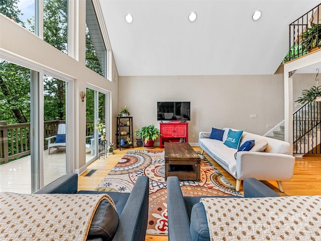 350 Mckissick Rd, Flat Rock, NC 28731 - living area featuring wood finished floors, stairway, high vaulted ceiling, and recessed lighting