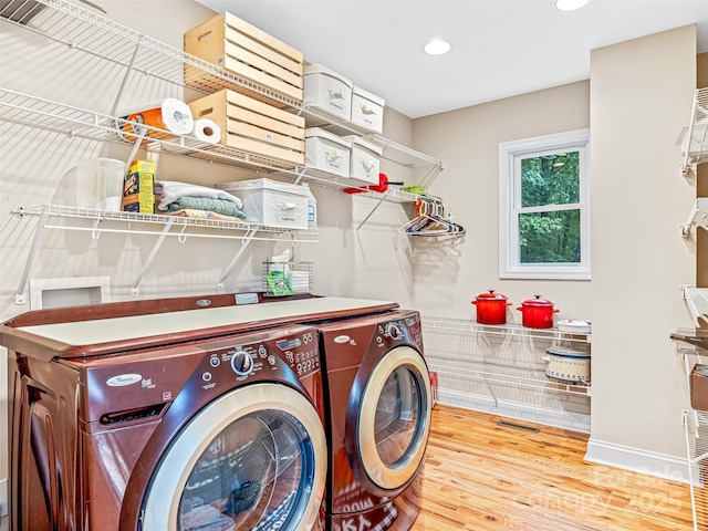 350 Mckissick Rd, Flat Rock, NC 28731 - washroom featuring washing machine and dryer, wood finished floors, recessed lighting, and baseboards