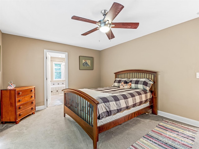 350 Mckissick Rd, Flat Rock, NC 28731 - carpeted bedroom featuring baseboards, connected bathroom, and a ceiling fan
