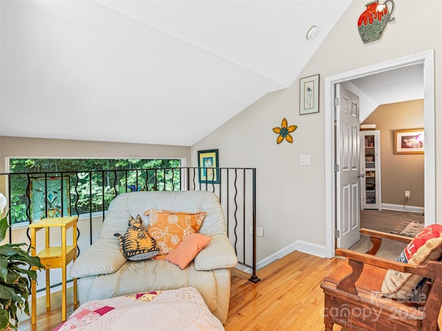 350 Mckissick Rd, Flat Rock, NC 28731 - living area with vaulted ceiling, light wood-style flooring, and baseboards