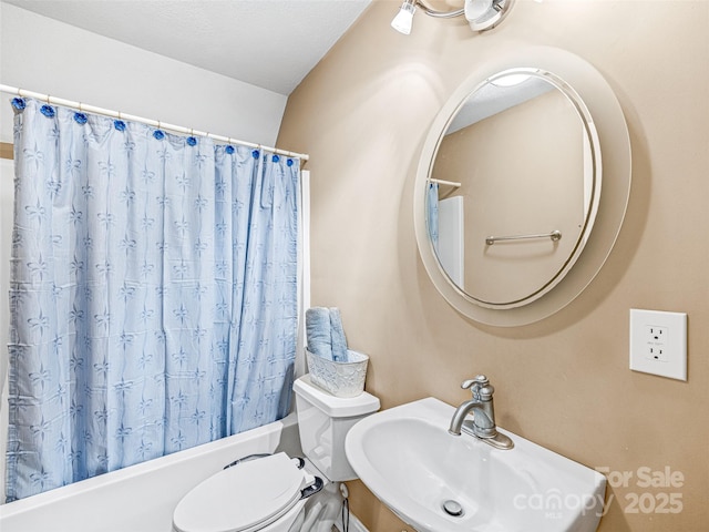 350 Mckissick Rd, Flat Rock, NC 28731 - bathroom with a sink, shower / bath combination with curtain, and toilet