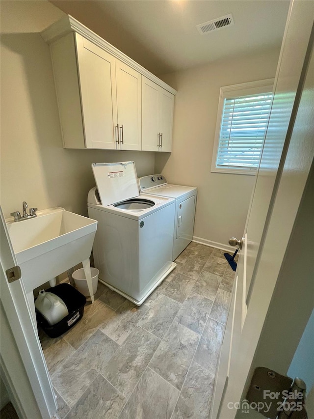 5005 Blue Serenity Ct, Denver, NC 28037 - washroom with independent washer and dryer, cabinet space, light stone finish flooring, and baseboards