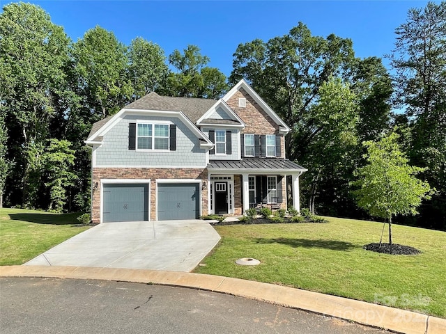 5005 Blue Serenity Ct, Denver, NC 28037 - view of front of house with a front lawn, concrete driveway, a garage, and stone siding
