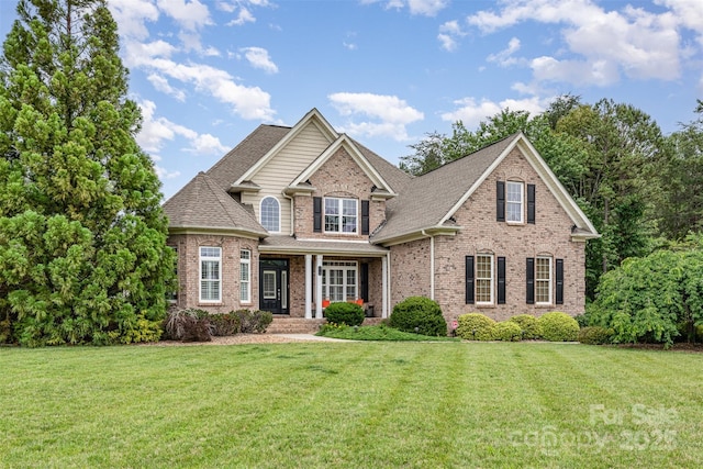 6057 Erie View Ct, Denver, NC 28037 - view of front of property with brick siding, a front yard, and roof with shingles