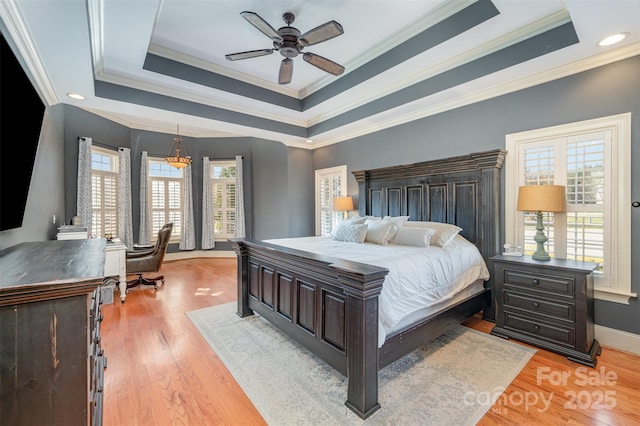 6057 Erie View Ct, Denver, NC 28037 - bedroom with ornamental molding, multiple windows, light wood-type flooring, baseboards, and a tray ceiling