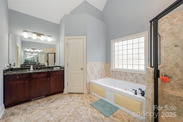 6057 Erie View Ct, Denver, NC 28037 - bathroom featuring a shower stall, a jetted tub, vanity, and high vaulted ceiling