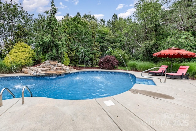 6057 Erie View Ct, Denver, NC 28037 - outdoor pool with a patio and view of scattered trees