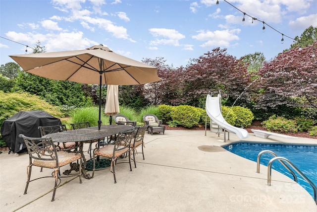6057 Erie View Ct, Denver, NC 28037 - outdoor pool featuring area for grilling, a patio, a water slide, and outdoor dining space