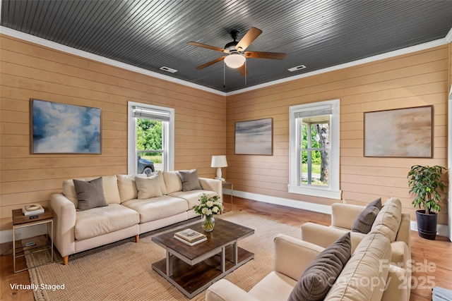 233 Sellars Rd, Kings Mountain, NC 28086 - living room featuring wood finished floors, plenty of natural light, baseboards, wood walls, and ceiling fan