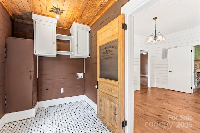 233 Sellars Rd, Kings Mountain, NC 28086 - laundry area featuring wooden walls, a chandelier, wood ceiling, cabinet space, and washer hookup